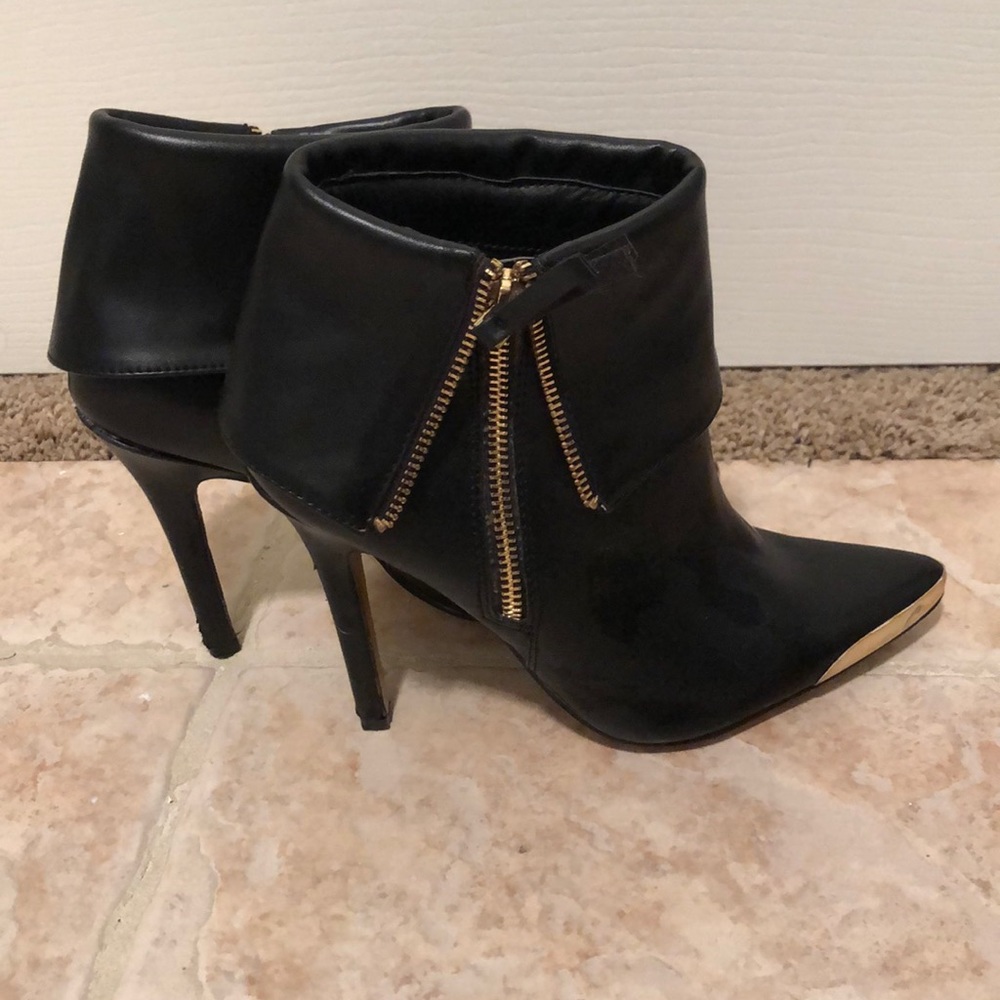 Black ankle booties with gold detail